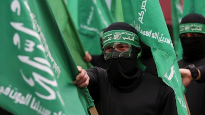 Masked Hamas militants during a protest in Gaza City, Feb. 14, 2020.