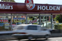 A car drives past a dealership of Holden, General Motors' Australian subsidiary, in Sydney, Dec. 11, 2013.