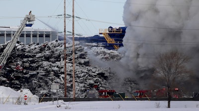 Firefighters at the Northern Metal Recycling plant, Feb. 19, 2020, in Becker, Minn.