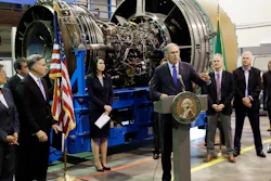 Washington Gov. Jay Inslee speaks in front of an airplane engine at South Seattle College, June 6, 2018.