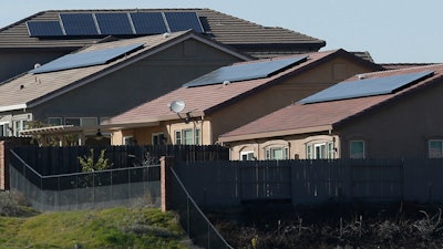 Solar panels on rooftops of a housing development in Folsom, Calif., Feb. 12, 2020.