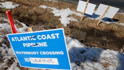 Signs mark the route of the Atlantic Coast Pipeline in Deerfield, Va., Feb. 8, 2018.