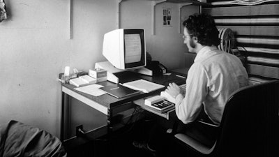 In this 1970s photo provided by Xerox PARC, Larry Tesler uses the Xerox Parc Alto early personal computer system.