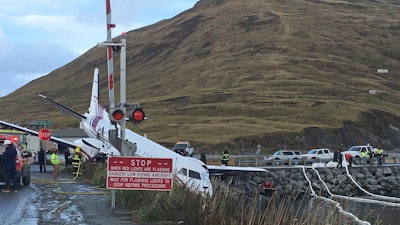 This Oct. 17, 2019, file photo shows a commuter airplane that crashed near the airport in Unalaska, Alaska, killing a passenger.
