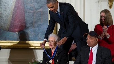 President Barack Obama presents the Presidential Medal of Freedom to NASA mathematician Katherine Johnson in the East Room of the White House, Nov. 24, 2015.