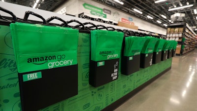 Reusable shopping bags displayed inside an Amazon Go Grocery store set to open soon in Seattle's Capitol Hill neighborhood, Feb. 21, 2020.