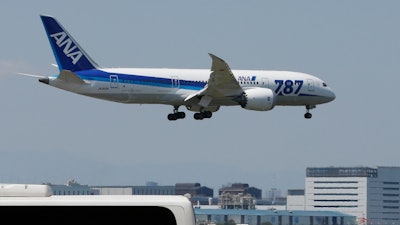 An ANA Boeing 787 prepares to land after a test flight at Haneda Airport in Tokyo, April 28, 2013.