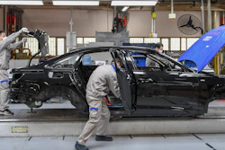 Workers assemble Audi A6 L cars at a workshop of FAW-Volkswagen Automobile Co., Ltd. in Changchun, China, Feb. 17, 2020.