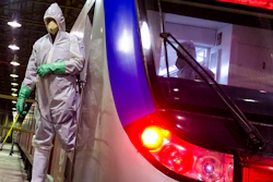 Workers disinfect subway trains against coronavirus in Tehran, Feb. 25, 2020.