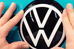 A worker completes an electric car ID.3 body at the Volkswagen plant in Zwickau, Germany, Feb. 25, 2020.