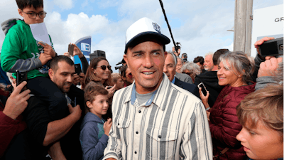 Surfer Kelly Slater surrounded by fans in Anglet, France, Oct. 9, 2019.