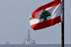 A Lebanese flag in the wind as the drilling ship Tungsten Explorer is seen off the coast of Beirut, Feb. 27, 2020.
