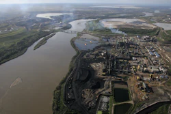 Aerial view of the Athabasca River running through oil sands developments in Alberta, June 25, 2008.