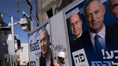 Election campaign billboards in Tel Aviv showing Prime Minister Benjamin Netanyahu (left), alongside the Blue and White alliance leaders Moshe Yaalon and Benny Gantz, April 2019.