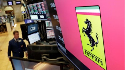 The Ferrari logo above a trading post on the floor of the New York Stock Exchange, Aug. 1, 2018.