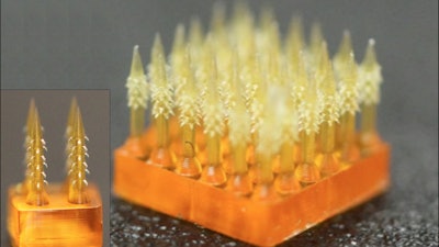 Microneedle array with backward-facing barbs to interlock with tissue.