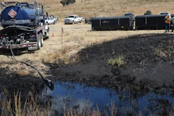 Workers monitor the site of an underground oil pipeline break near Refugio State Beach, north of Goleta, Calif., May 20, 2015.