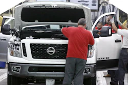 Technicians inspect vehicles on the assembly line at the Nissan Canton Assembly Plant in Canton, Miss., March 19, 2018.