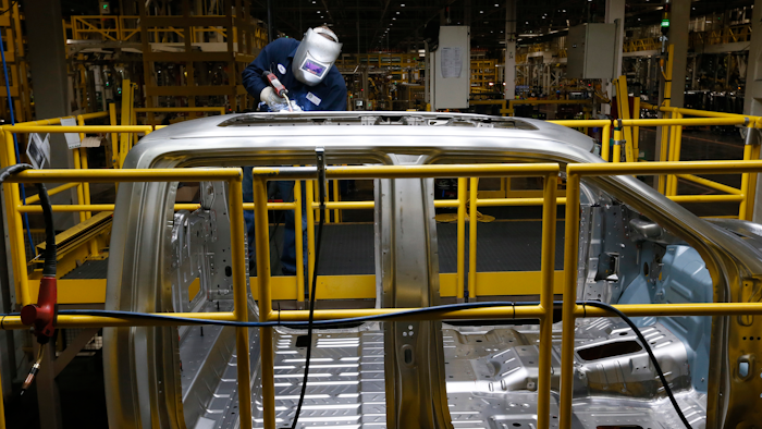 Ron Hudgins welds a 2015 Ford F-150 cab at the Dearborn Truck Plant, Dearborn, Mich., Nov. 11, 2014.