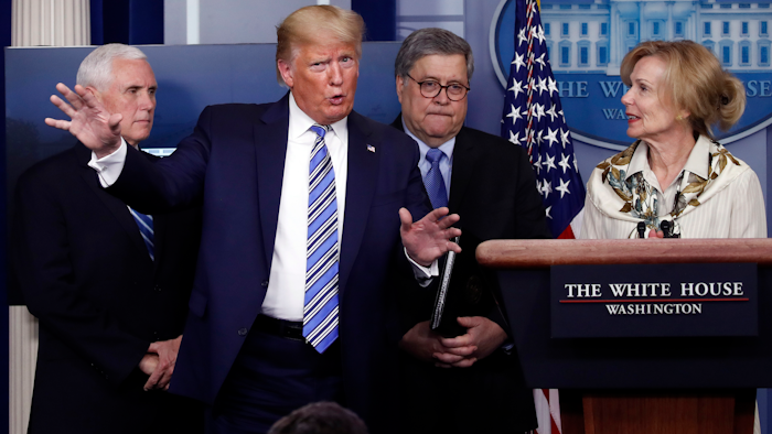 President Donald Trump gestures during a briefing about the coronavirus in the James Brady Briefing Room, March 23, 2020, in Washington.