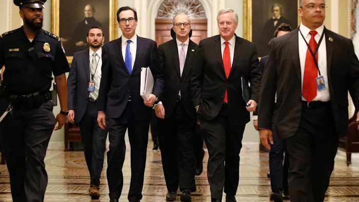 Treasury Secretary Steven Mnuchin, left, White House Legislative Affairs Director Eric Ueland and acting White House chief of staff Mark Meadows on Capitol Hill, March 24, 2020.