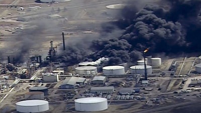 In this image from video, smoke rises from the Husky Energy oil refinery after an explosion and fire at the plant in Superior, Wis., April 26, 2018.
