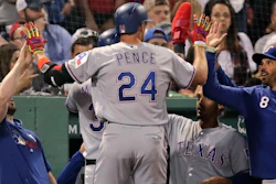 The Texas Rangers' Hunter Pence is congratulated after his inside the park home run against the Boston Red Sox at Fenway Park, June 11, 2019.