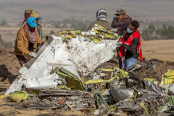In this March 11, 2019, file photo, rescuers work at the scene of an Ethiopian Airlines flight crash near Bishoftu, Ethiopia.