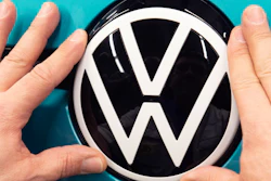 A worker completes an electric ID.3 body at the Volkswagen assembly plant in Zwickau, Germany, Feb. 25, 2020.