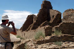 Chris Farthing of Suffolks County, England, takes a picture of Anasazi ruins in Chaco Culture National Historical Park in New Mexico, Aug. 10, 2005.
