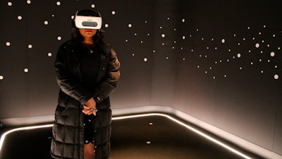 A visitor experiences 'The March' virtual reality exhibit at the DuSable Museum of African American History, Chicago, Feb. 26, 2020.