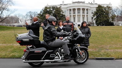 Harley-Davidson President and CEO Matthew Levatich rides his motorcycle onto the South Lawn of the White House, Feb. 1, 2017.