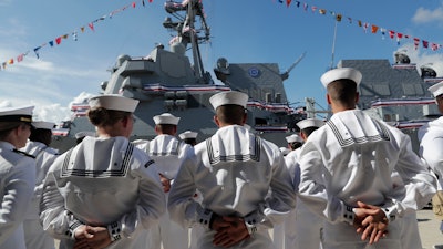 Sailors stand during a commissioning ceremony for the U.S. Navy guided missile destroyer USS Paul Ignatius, Port Everglades, Fort Lauderdale, Fla., July 27, 2019.