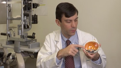 Dr. Jason Comander, inherited retinal disorder specialist at Massachusetts Eye and Ear Infirmary in Boston, points to a model of an eye during an interview on Jan. 8, 2020.