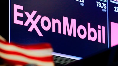 The logo for ExxonMobil above a trading post on the floor of the New York Stock Exchange, April 23, 2018.