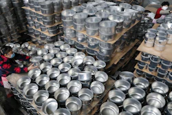 Workers arrange stew pots at a factory in Hangzhou, China, Feb. 27, 2020.