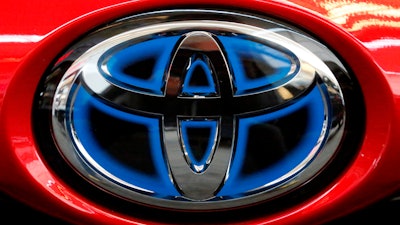 Toyota logo on the trunk of a 2018 Prius at the Pittsburgh Auto Show, Feb. 15, 2018.