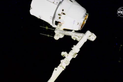 NASA astronauts Andrew Morgan and Jessica Meir use the International Space Station's robot arm to capture the Dragon capsule, March 9, 2020.