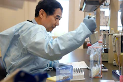 Microbiologist Xiugen Zhang runs a test at the Connecticut State Public Health Laboratory in Rocky Hill, Conn., March 2, 2020.