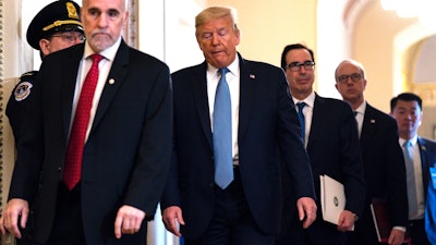 President Donald Trump leaves a meeting with Republican lawmakers on Capitol Hill, March 10, 2020.