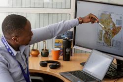 Kenneth Mwangi, a satellite information analyst at the Intergovernmental Authority on Development's Climate Prediction and Applications Center, shows a map predicting the movement of desert locust swarms, Nairobi, Kenya, March 5, 2020.