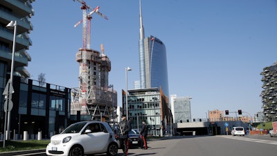 Police officers man a road block in Milan, March 16, 2020.