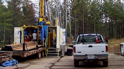 A prospecting drill rig bores into the bedrock near Ely, Minn., Oct. 4, 2011.