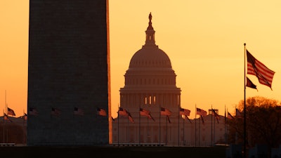 The Washington Monument and U.S. Capitol at sunrise, March 18, 2020.