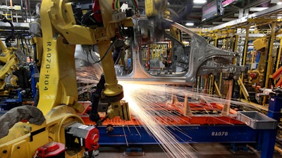 Robots weld a Chevrolet Sonic at the General Motors Orion Assembly plant, Orion Township, Mich., May 19, 2011.