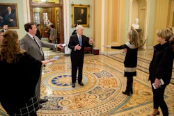 Senate Majority Leader Mitch McConnell speaks to reporters outside the Senate chamber, March 23, 2020.