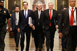 Treasury Secretary Steven Mnuchin, left, White House Legislative Affairs Director Eric Ueland and acting White House chief of staff Mark Meadows on Capitol Hill, March 24, 2020.
