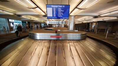 Empty baggage carousel at Denver International Airport, March 20, 2020.