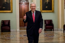 Senate Majority Leader Mitch McConnell of Ky. arrives on Capitol Hill, March 25, 2020.