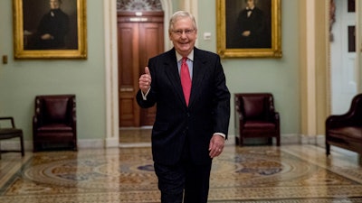 Senate Majority Leader Mitch McConnell of Ky. arrives on Capitol Hill, March 25, 2020.